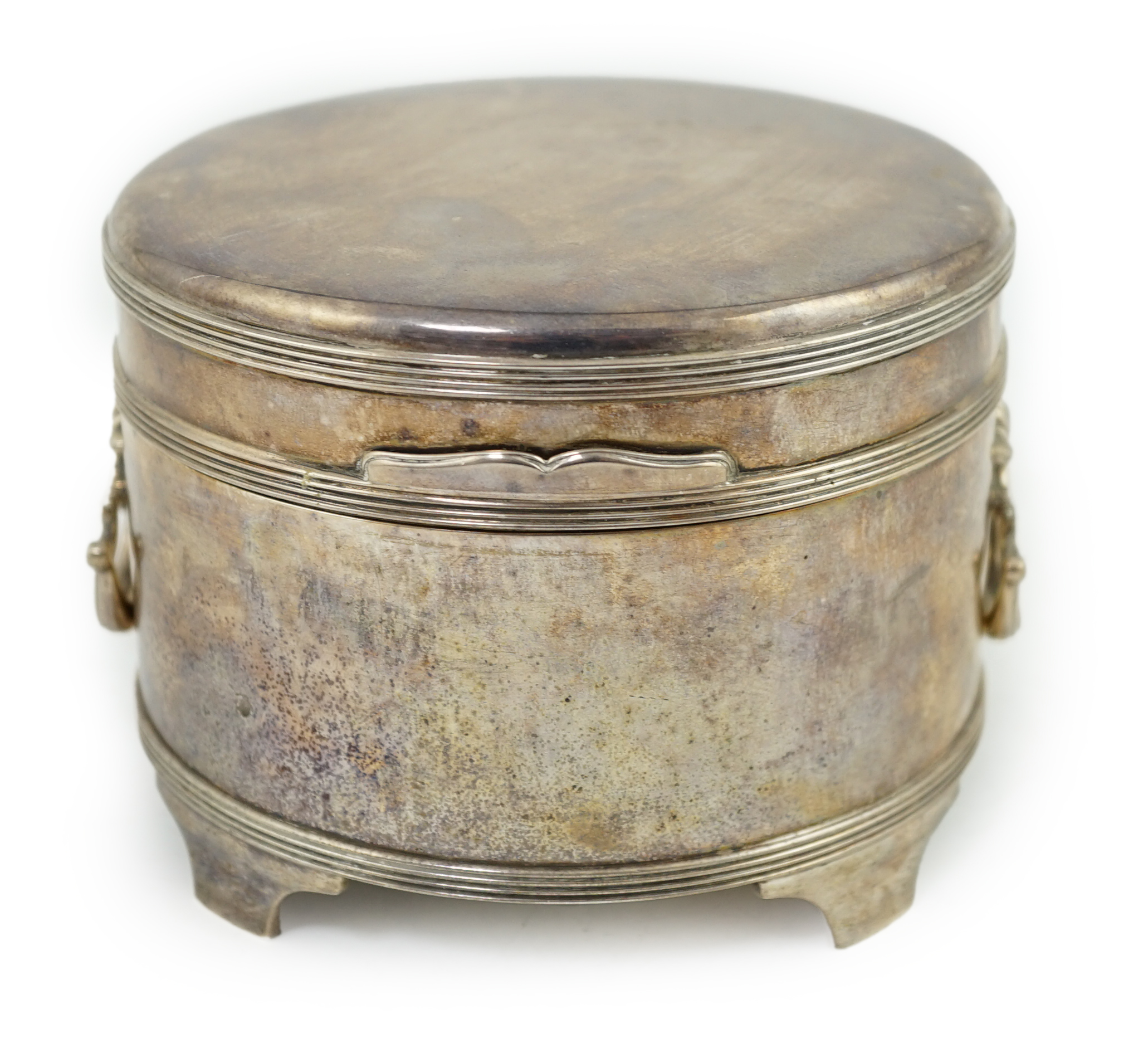 A George V silver circular two handed biscuit box, with hinged cover, by Asprey & Co Ltd